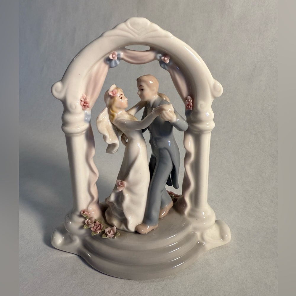 Elegant Wedding Cake Topper with Bride and Groom